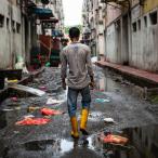 Rohingya worker seen walking on a street around the Pasar Baru market @Arnaud Finistre