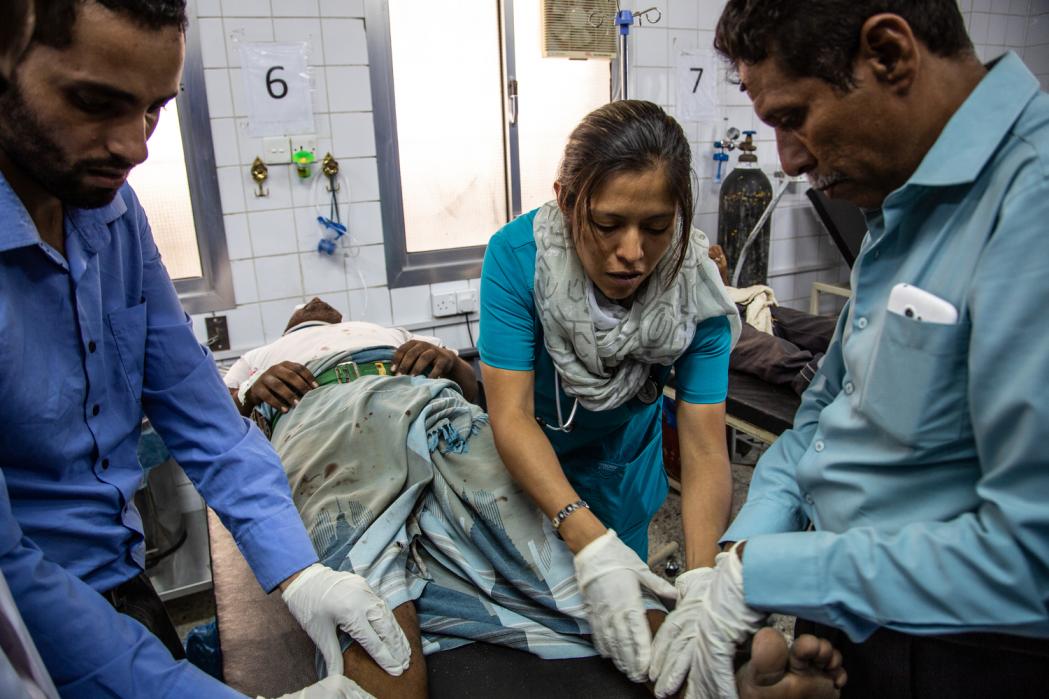 An ER doctor is examining a patient injured during a road traffic accident