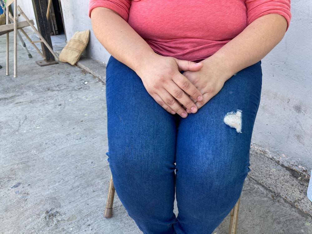 Maria, 33, fled with her husband and two children, due to gang threats.