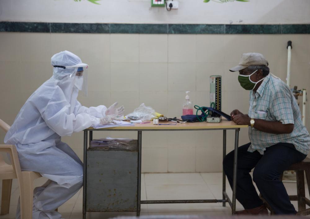 Checking a patient in the consultation room of Designated COVID-19 health centre 