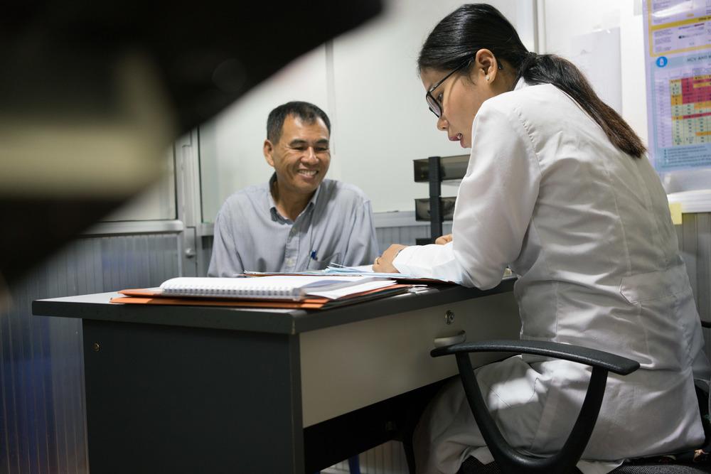 Din Savorn, 50, receives news that the hepatitis C treatment was a success, from MSF Doctor Hang Vithuneat, at the MSF Hepatitis C clinic at Preah Kossamak Hospital in Phnom Penh, Cambodia. April 2017. © Todd Brown 