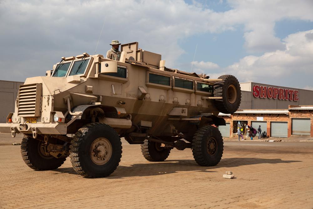 16 July 2021: A SANDF Casspir stands guard outside the Eyethu Mall in Orange Farm. © James Oatway/MSF