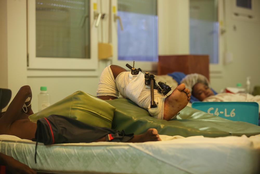 Mecial team from Tabarre hospital is attending a patient, wounded during the earthquake.