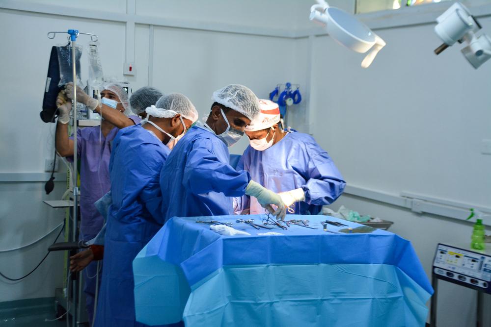 Surgery team conducting a cesarean section alongside the operating theatre team at the Al-Qanawis mother and child hospital in Hodeidah, Yemen. 