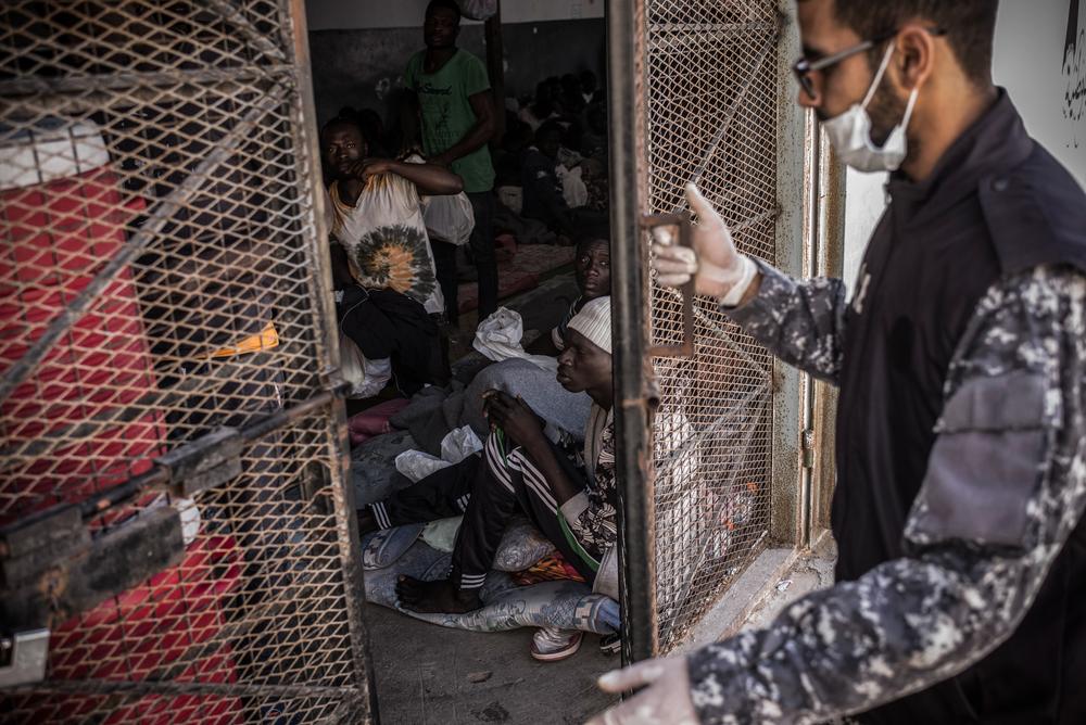A guard is closing the door of a cell in Abu Salim detention center in Tripoli.