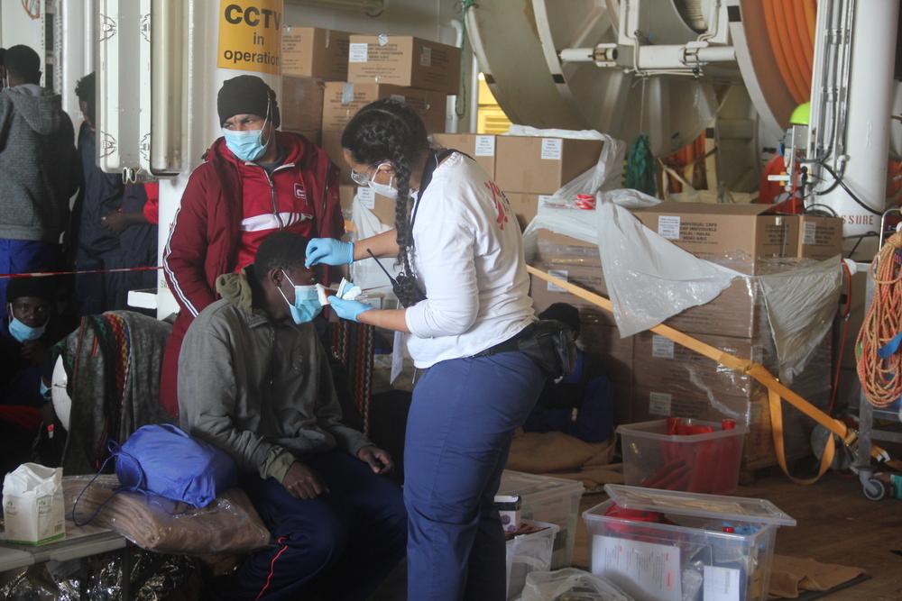 MSF's midwife assisting a survivor from rescue 4, on December 22, 2021.