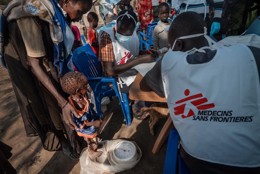 A child is weighed at a mobile clinic on Rubkona.