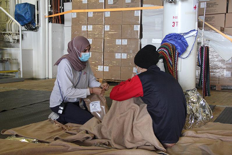MSF's psychologist on board the Geo Barents talking to a survivor.