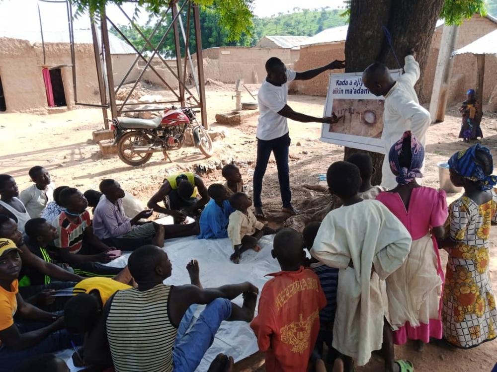Community members participate in a training on safer mining practices. 