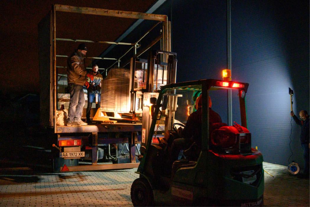 Late-night loading of MSF emergency medical supplies onto a train at Lviv station, to be dispatched as rapidly as possible to hospitals in Kyiv.