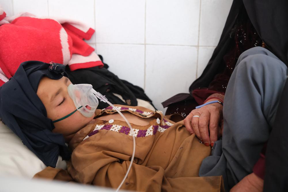 A patient in the measles isolation ward at Boost hospital.