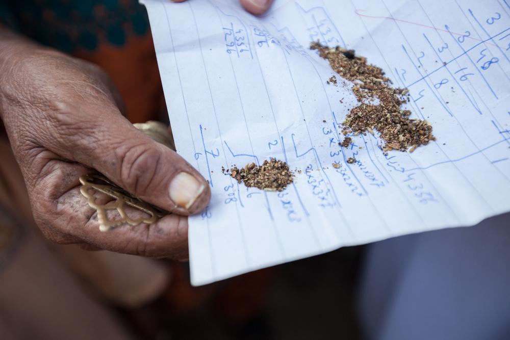 Gulshan’s mother holds mixed herbs. She says that traditionally, this is what they will feed the child, in addition to breast milk, for the first few weeks.