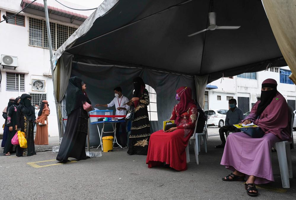 Some patients are queuing.