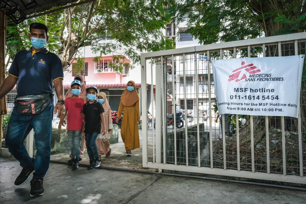 A husband, wife and their four children walking into the Doctors Without Borders’ mobile clinic.