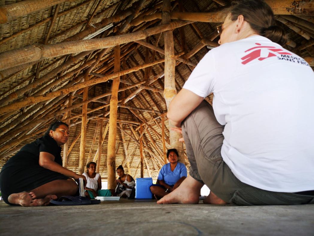 MSF project medical referent and midwife, Sandra Sedlmaier-Ouattara talks with Antje Reiher Tebwana, NCD public health specialist with the Kiribati Ministry of Health and Medical Services (left), and nurse Teraitinikarawa Reti (in blue) in Tabituaea North, on the outer islands of Kiribati.