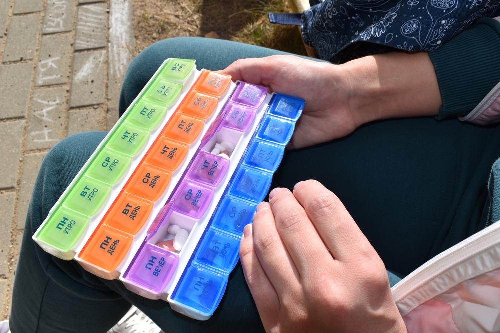 Maria 34 years old, a SMARRTT operational study patient, shows her monthly pill box organizer. She has to take few pills a day to fight MDR-TB. Belarus