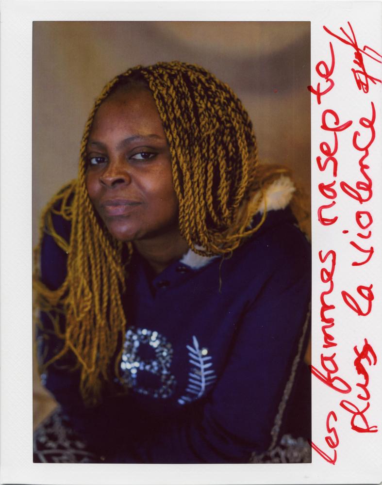 "Women, do not accept violence anymore!" Decrichelle, Cameroonian, 32 years old. Mediterranean Sea, 2022. © Mahka Eslami