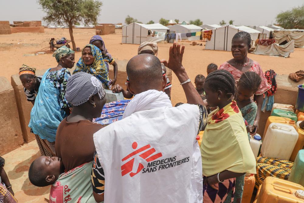 Women taking water at a water point rehabilitated by MSF in Djibo. Burkina Faso, April 2023. © MSF/Nisma Leboul