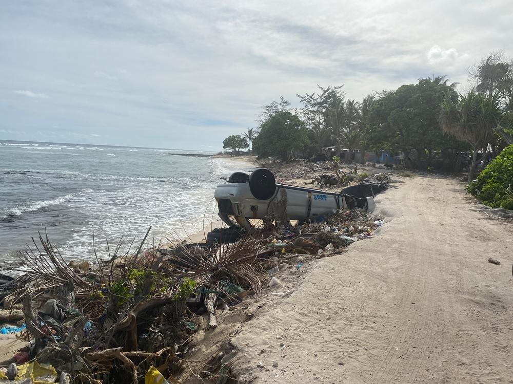 On a beach in a village in South Tarawa, the piles of rubbish littering the beach are everywhere. Locals have constructed barriers (built out of rubbish, tyres and sometimes cars) to protect the banks from sea surges and king tides. Kiribati, March 2023. © MSF/Nicolette Jackson