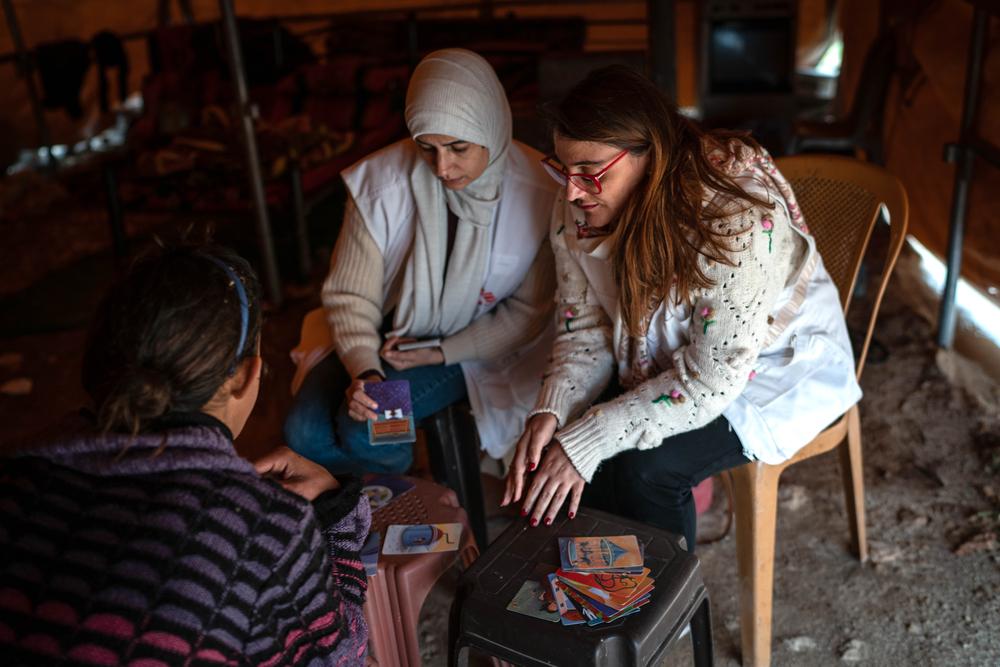 Doctors Without Borders workers conduct a mental health session with Jinan, whose house was demolished by Israeli forces, in Douma. Palestine, April 2023. © Samar Hazboun 