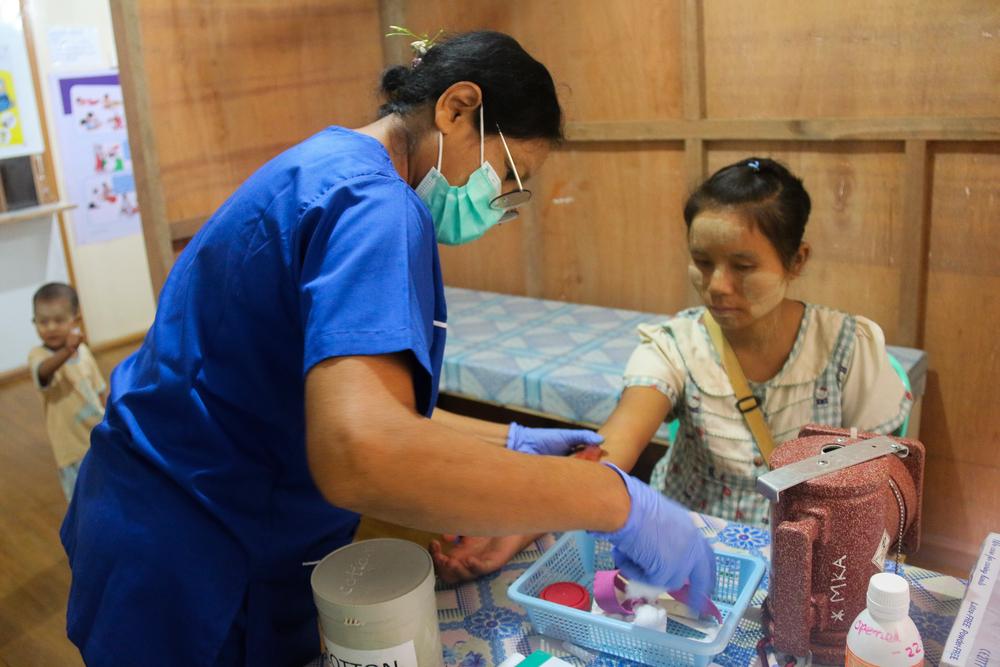 A patient attends the new clinic in Bhamo, Kachin state to receive antenatal care throughout her second pregnancy. Myanmar, August 2023.