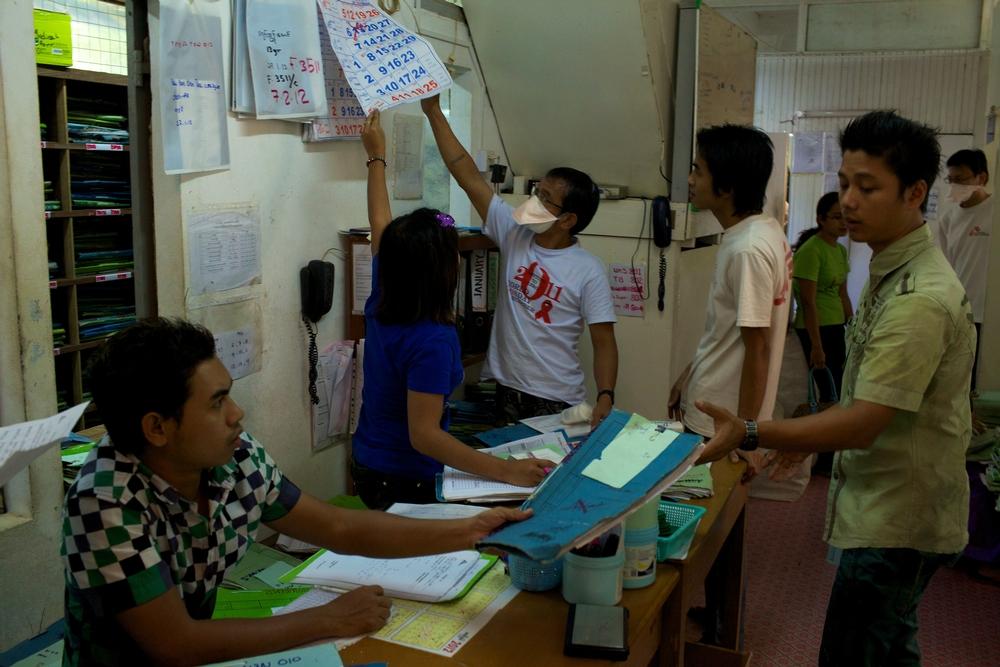 Doctors Without Borders staff manages the daily routines, registers patients coming in for consultation, and files the folders corresponding to the various patients. Myanmar, February 2012. © Matthieu Zellweger