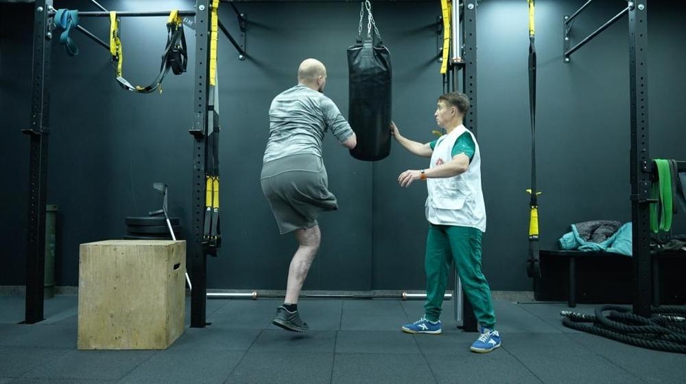 MSF physiotherapist is working with a 27-year-old patient preparing for prosthetics after sustaining injuries during fighting on the frontlines in Ukraine.