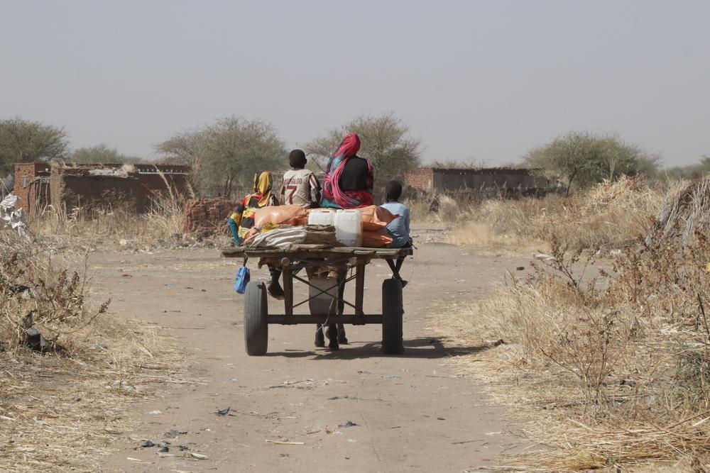One of the families on their way home after receiving the food baskets in food distribution programme in Sudan.