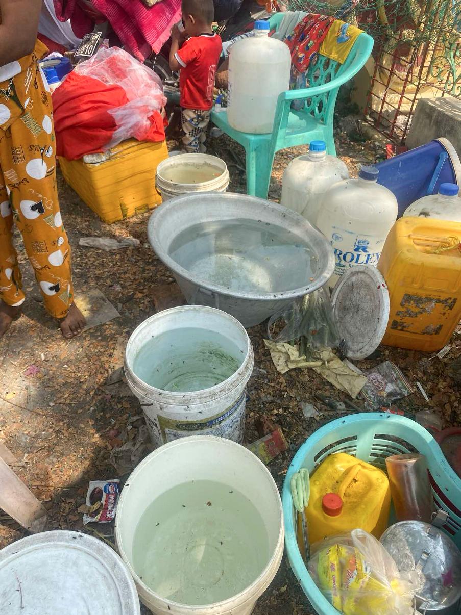 Drinking water in temporary internally displaced people (IDP) camp in U Pwar Pagoda Compound in Mandalay