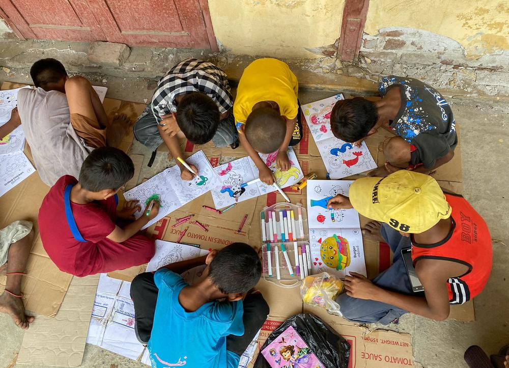 A mental health session for children: drawing together, and acknowledging each other’s creativity and effort during our mobile clinic in Bhone Oh camp, Mandalay.