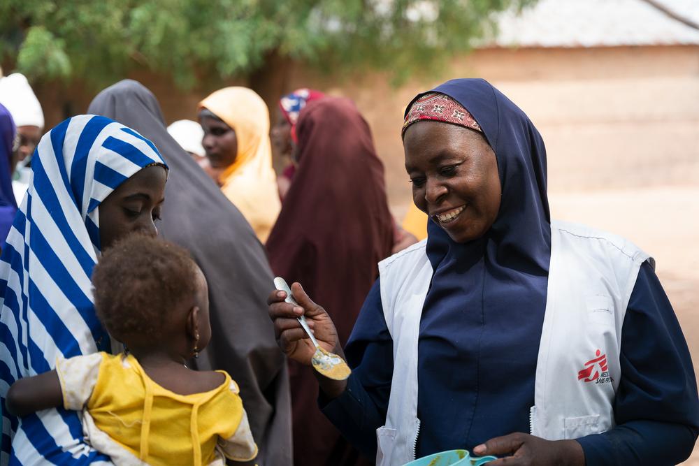 MSF staff with child